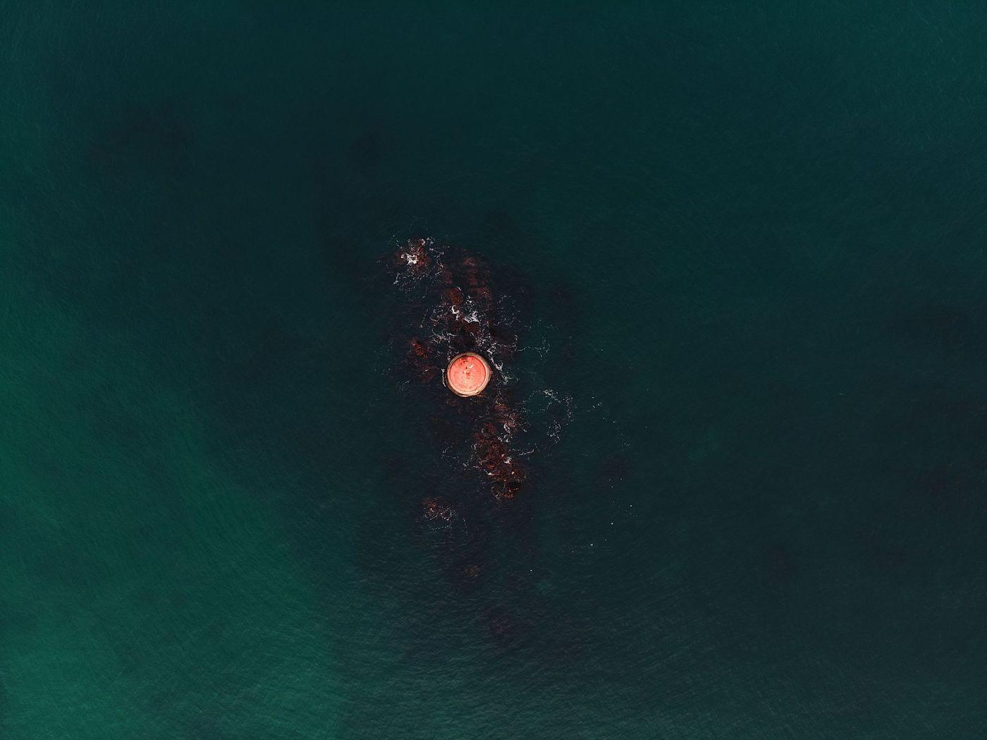 A moored monitoring buoy carrying water-quality instruments in open water
